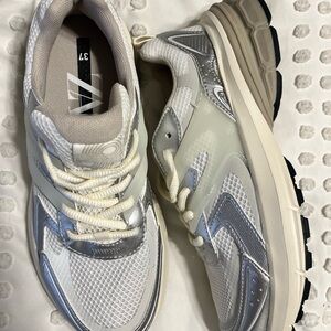 Stylish White and Silver Sneakers